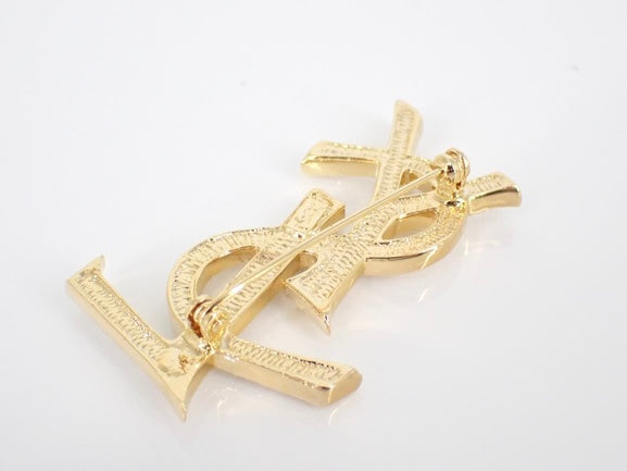 yves saint laurent gone-tone logo rhinestone brooch
