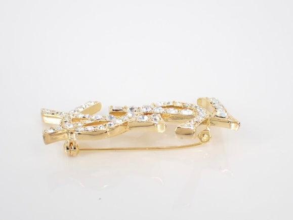yves saint laurent gone-tone logo rhinestone brooch