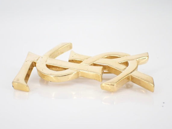 yves saint laurent gone-tone logo brooch