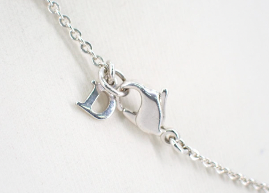 christian dior silver tone logo necklace