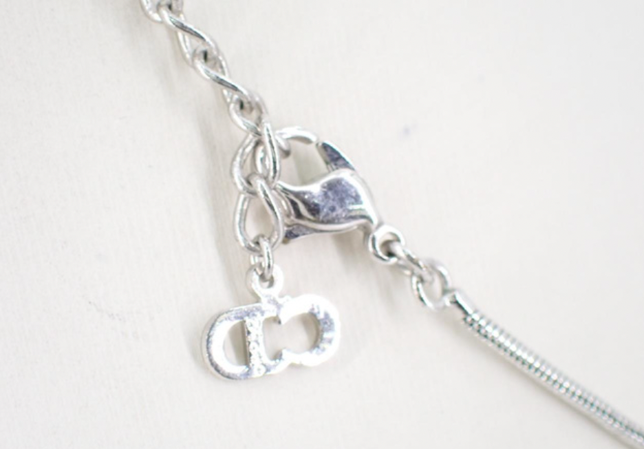 christian dior silver tone logo necklace