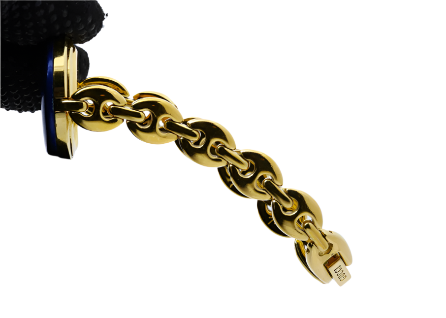 gucci elegant gold watch with blue bezel detail