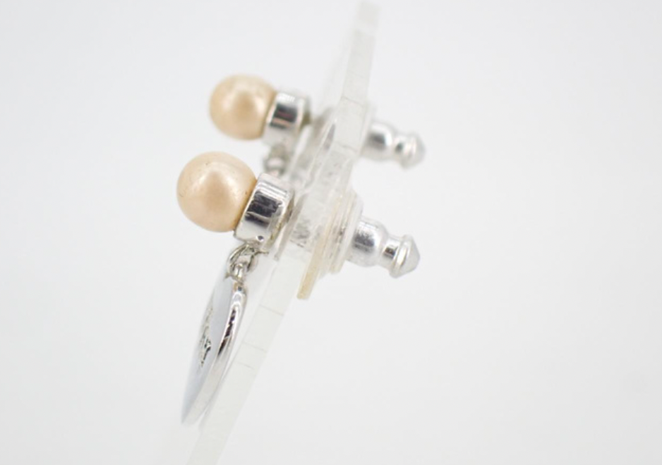 christian dior heart-shaped earrings with pearl detailing