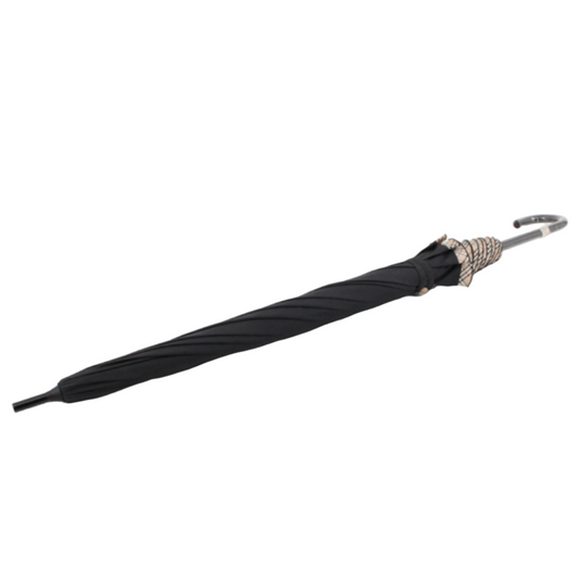 Black umbrella with decorative handle on a white grid background